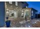 Backyard patio with pavers, decorative plants, and string lights for ambiance at 1945 Canyon Highlands Dr, Henderson, NV 89052