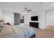 Bedroom featuring neutral carpet, furnishings, and a sliding glass door with deck access at 1945 Canyon Highlands Dr, Henderson, NV 89052