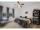 Neutral bedroom featuring a fan, closet space, grey carpet, and natural light at 1945 Canyon Highlands Dr, Henderson, NV 89052