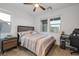 Comfortable bedroom with a ceiling fan, carpeted floors, a large window, and a stylish headboard at 1945 Canyon Highlands Dr, Henderson, NV 89052