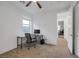 Bright bedroom with a large window providing natural light, a modern desk area, and neutral carpeting at 1945 Canyon Highlands Dr, Henderson, NV 89052