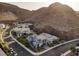 Stunning neighborhood nestled against a backdrop of majestic mountains, surrounded by desert landscaping at 1945 Canyon Highlands Dr, Henderson, NV 89052