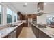 Bright kitchen featuring granite countertops, stainless steel appliances, and ample cabinet space with lots of natural light at 1945 Canyon Highlands Dr, Henderson, NV 89052