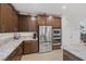 Close up view of the kitchen with stainless steel appliances, granite countertops, and modern cabinetry at 1945 Canyon Highlands Dr, Henderson, NV 89052