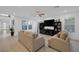 Spacious living room with dual couches, media center, and large windows for natural light at 1945 Canyon Highlands Dr, Henderson, NV 89052