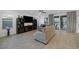 Bright living room featuring comfortable seating, a large TV, and sliding glass doors to the outdoor space at 1945 Canyon Highlands Dr, Henderson, NV 89052