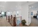 Open loft with hardwood railing, neutral walls and carpet, and plenty of natural light at 1945 Canyon Highlands Dr, Henderson, NV 89052