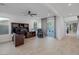 Spacious office area with tile floors, ceiling fan and natural light from large windows at 1945 Canyon Highlands Dr, Henderson, NV 89052