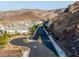 Neighborhood street featuring modern desert homes against a backdrop of rugged mountains and scenic terrain at 1945 Canyon Highlands Dr, Henderson, NV 89052
