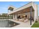 Contemporary backyard featuring a large pool, lounge area, and seamless transition to indoor living at 21 Grey Owl Ct, Las Vegas, NV 89135