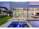Modern home featuring a backyard with a beautiful pool, minimalist landscaping, and seamless indoor-outdoor living at 21 Grey Owl Ct, Las Vegas, NV 89135