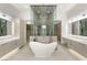 Luxurious bathroom showcasing a stand alone tub and a modern shower with unique marble backsplash at 21 Grey Owl Ct, Las Vegas, NV 89135