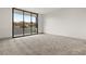 Large bedroom with sliding glass doors with views at 21 Grey Owl Ct, Las Vegas, NV 89135