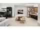Bright open dining room with bar and view of the kitchen at 21 Grey Owl Ct, Las Vegas, NV 89135