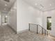Upstairs hallway with modern railing and carpet, leads to bedrooms at 21 Grey Owl Ct, Las Vegas, NV 89135