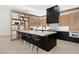 Modern kitchen with island and bar seating at 21 Grey Owl Ct, Las Vegas, NV 89135