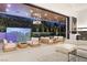 Stylish indoor-outdoor living with a pool view, comfortable seating, and modern lighting features at 21 Grey Owl Ct, Las Vegas, NV 89135