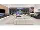 Open concept living room featuring an indoor/outdoor living space and modern decor, perfect for entertaining guests at 21 Grey Owl Ct, Las Vegas, NV 89135