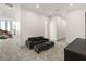 Living area with modern sofa, ottomans and views out the window at 21 Grey Owl Ct, Las Vegas, NV 89135