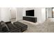 Living area featuring a large TV, sleek console, and comfortable seating at 21 Grey Owl Ct, Las Vegas, NV 89135