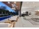 Open indoor/outdoor living space featuring a modern pool and sleek interiors perfect for entertaining at 21 Grey Owl Ct, Las Vegas, NV 89135