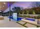 Backyard with a modern pool, patio, and a stunning water feature, perfect for entertaining or relaxing outdoors at 21 Grey Owl Ct, Las Vegas, NV 89135