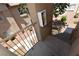 A balcony with railings overlooking a walkway and landscaped area adds architectural interest and outdoor space at 2110 Los Feliz St # 2052, Las Vegas, NV 89156