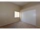 A bright bedroom featuring sliding door closet, neutral walls, carpet floor, and a window at 2110 Los Feliz St # 2052, Las Vegas, NV 89156