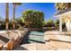 Stunning pool with flagstone patio and rock accents at 2179 Bridlewood Dr, Las Vegas, NV 89119