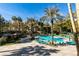 Inviting swimming pool surrounded by lush landscaping at 220 E Flamingo Rd # 201, Las Vegas, NV 89169