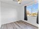 Well-lit bedroom featuring a large window and dark curtains at 2325 Windmill Pkwy # 1711, Henderson, NV 89074