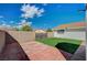 Artificial turf backyard with patio and block wall at 2690 S Dandelion St, Pahrump, NV 89048