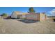 Large gravel backyard with block wall and gated access at 2690 S Dandelion St, Pahrump, NV 89048