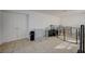 Unfinished basement area with tiled floor, showing pet enclosures at 2690 S Dandelion St, Pahrump, NV 89048
