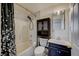 Clean bathroom with a shower/tub combo and dark vanity at 2690 S Dandelion St, Pahrump, NV 89048