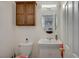 Small bathroom with toilet, sink, and vanity at 2690 S Dandelion St, Pahrump, NV 89048