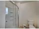 Clean bathroom with a toilet, shower, and shelf at 2690 S Dandelion St, Pahrump, NV 89048