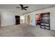 Main bedroom with carpet, ceiling fan and en-suite bathroom at 2690 S Dandelion St, Pahrump, NV 89048