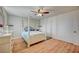 Spacious bedroom with a white post bed and ceiling fan at 2690 S Dandelion St, Pahrump, NV 89048