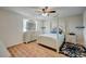Bedroom with white post bed and ceiling fan at 2690 S Dandelion St, Pahrump, NV 89048
