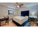 Bedroom with a blue velvet headboard and wood floors at 2690 S Dandelion St, Pahrump, NV 89048