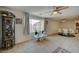 Dining area with white table and chairs, adjacent to living room at 2690 S Dandelion St, Pahrump, NV 89048