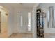Entryway with white door and decorative curio cabinet at 2690 S Dandelion St, Pahrump, NV 89048