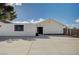 Side view of a newly painted home with a large concrete patio area at 2690 S Dandelion St, Pahrump, NV 89048