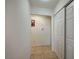 Simple hallway with tile flooring and white doors at 2690 S Dandelion St, Pahrump, NV 89048