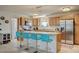 Modern kitchen features wood cabinets, granite countertops and a breakfast bar at 2690 S Dandelion St, Pahrump, NV 89048