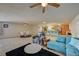 Open living area with sectional sofa, and views of kitchen and dining areas at 2690 S Dandelion St, Pahrump, NV 89048