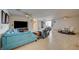 Open concept living room with sectional sofa and large TV at 2690 S Dandelion St, Pahrump, NV 89048