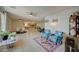 Open living room with tile floors, and access to kitchen and dining at 2690 S Dandelion St, Pahrump, NV 89048