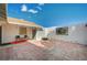 Large tiled patio with seating area and grill at 2690 S Dandelion St, Pahrump, NV 89048